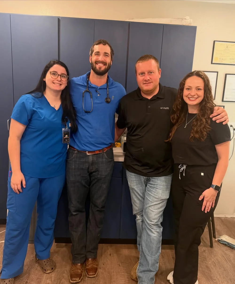 The Tennessee Valley Veterinary Services team standing together inside the clinic